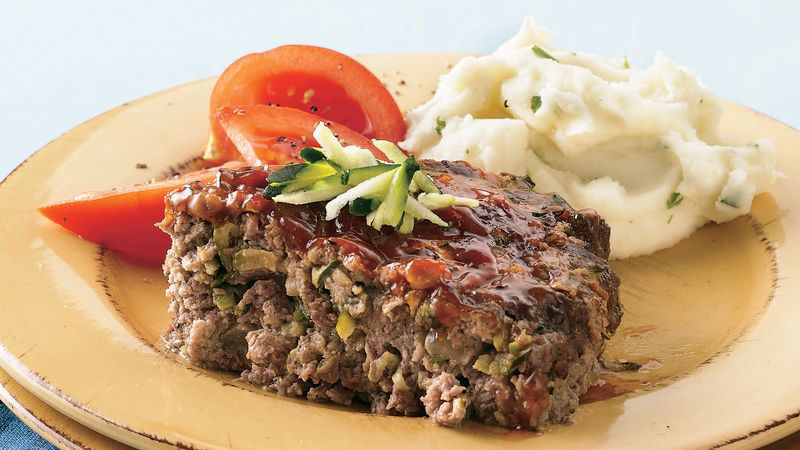 Add nutrition in disguise—kids might eat that green veggie when it’s mixed in a tasty meatloaf. Ingredients Meatloaf 2 eggs, slightly beaten 2 cups shredded zucchini (1 large or 2 small) SAVE $ 1/3 cup Progresso™ plain bread crumbs 1/3 cup chopped onion 1 teaspoon salt 1/2 teaspoon dried oregano leaves 1/4 teaspoon pepper 1 1/2 lb lean (at least 80%) ground beef SAVE $ Topping 1 tablespoon packed brown sugar 2 tablespoons ketchup 1/2 teaspoon yellow mustard Heat oven to 350°F. In large bowl, mix all meatloaf ingredients until well blended. Press mixture into ungreased 9 1/2-inch deep-dish glass pie plate. Bake 35 minutes. Meanwhile, in small bowl, mix all topping ingredients. Remove meatloaf from oven; pour off drippings. Spread topping over loaf. Return to oven; bake 10 to 15 minutes longer or until thoroughly cooked in center and meat thermometer reads 160°F. Let stand 5 minutes before serving. Baking the meatloaf in a shallow pie plate takes less time than baking it in a loaf shape. Dinner can be on the table more quickly.